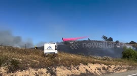 US: Air Tanker Drops Red Retardant to Tame Mission Fire