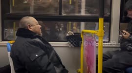 Pet dog sleeps inside owner’s hat as they ride on bus