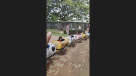 Kids enjoy riding truck train in farm