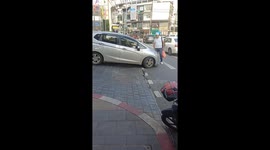 Angry tourist blocks car emerging onto road in Bangkok