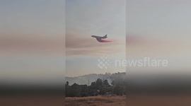US: Airplane Drops Red Retardant On Bonanza Wildfire As Flames Spread Across 181 Acres