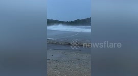 Fishermen rush to save gear from crashing waves as Hurricane Erick approaches Mexico