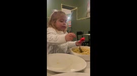 Little girl twirls spaghetti like a pro in Rome, Italy