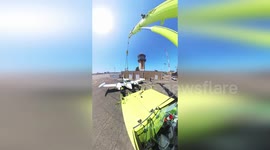 Light aircraft moved by crane at John Wayne Airport in California