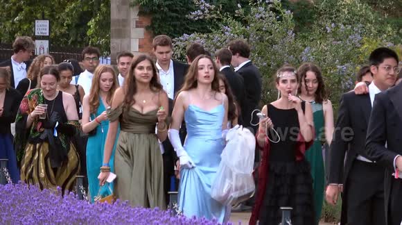 Students attend Oxford University’s sold out 320-pound-a-ticket Christ Church College May Ball in the blistering heat