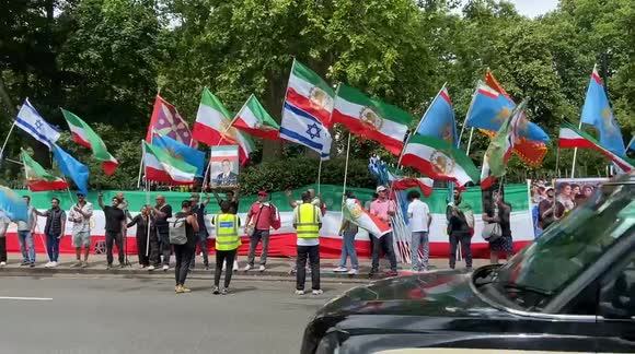 Pro-monarchy Iranians gather outside the Iranian Embassy in London in protest againt the Islamic Regime