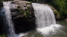 hiker stumbles across massive waterfall and decides to slide down it