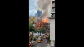 Huge fire in Manchester breaks out and hundreds are evacuated. Firemen can't contain it.