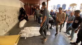 Relatives mourn as 10 Palestinians killed in Israeli strike on Qaza'at family home in Gaza