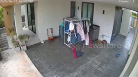 Clothes rack takes on a life of its own as it is blown inside