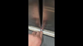 Man prevents ID card from falling through elevator door gap in Shanxi, China