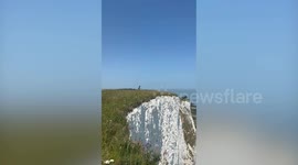 Moment daredevil parachutes off White Cliffs of Dover in front of stunned onlookers