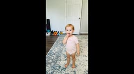 Two-year-old girl attempts to copy mum's workout in adorable video