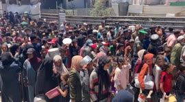 As Gaza faces growing food crisis, hundreds gather for aid meals