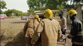 Thick smoke billows from the unit as crackers continue to burst inside the premises.