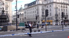 Police work at Piccadilly Circus crash site next to Eros Fountain - 29 June 2025