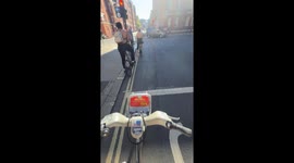 Cyclist spots topless biker and man wearing raincoat as Londoners bask in heatwave