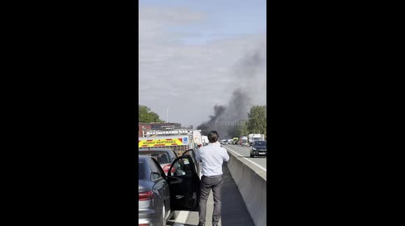 Car fire on the M1 near Milton Keynes causes severe traffic chaos with thick smoke, emergency response, and multi-mile delays.