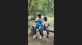 Monkey Snatches Chips From a Boy at a Park
