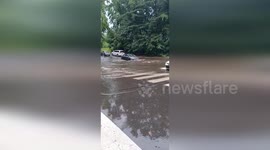 US: Floodwaters Engulf Northeast Philadelphia Streets Causing Driving Challenges
