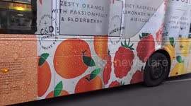 Piccadilly Circus car crash site with black BMW on its roof - 29 June 2025