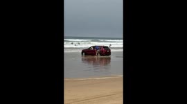 Elderly driver ignores warnings, ends up nose-first in ocean at California beach