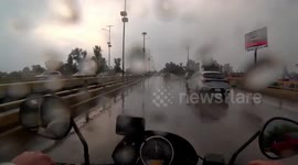 Motorcycle Slides Out From Rider On Wet Roads