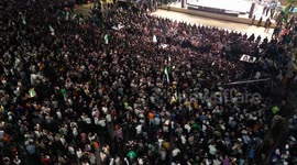 Syria: An aerial view of people gathering for the 