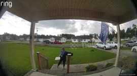 Delivery driver chucks pizza onto porch of house with Trump flag on display