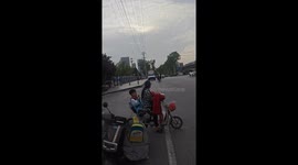 Man Balances on Electric Scooter