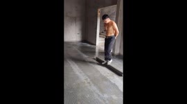 Man Balances on Narrow Steel Pipe