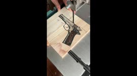 Craftsman Carves Pistol Silhouette
