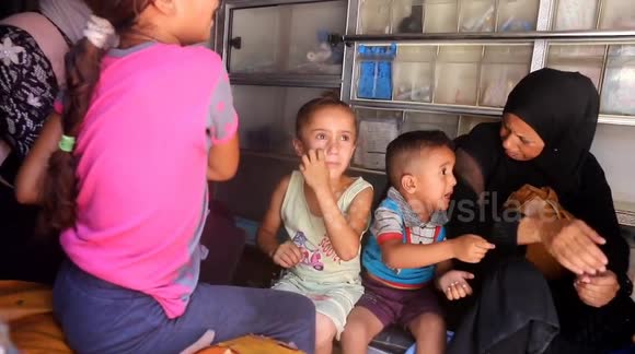 A Palestinian child weeps in pain inside an ambulance