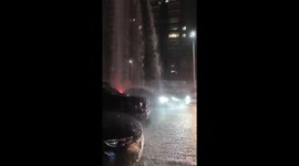 Car Gets Wash in Intense Rainstorm