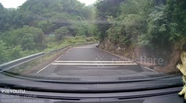 Thrilling Moment on the Mountain Road