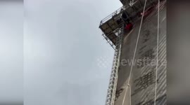Workers rescued from highway pylons in Italy