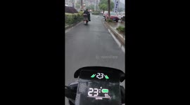Motorcyclist Skids While Turning in Rain