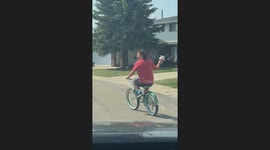Grandpa welcomes his grand boys to his house while riding a bike and using a bubble machine