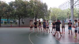 Man Throws Shot into Basket