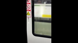 A Woman Buys Ci Ba at Light Rail Transit