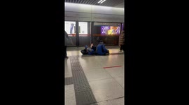 Two Students Rest in Subway Station