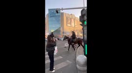 People in Xinjiang Travel on Horseback