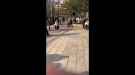 An Elderly Man Hangs Upside Down From a Tree