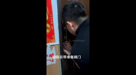 A Man Uses a Card to Unlock the Door