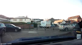 Driver in van tries turning around and hits large overhead sign