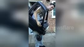 Newsflare Edit - Try not to laugh! crazy driver gets stuck in car!