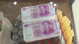 Bakery makes cakes which look like real money