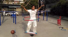 Man plays harmonica on balance plate