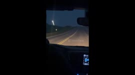 Incredible moment fireworks and lightning simultaneously light up night sky