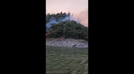 Thick wildfire smoke rises from Green Fire in Shasta Lake, California, USA